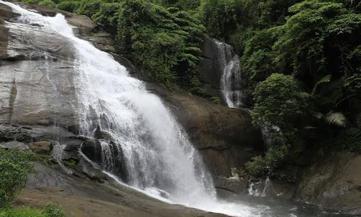 Beautiful Soochipara Falls in Monsoon with misty landscapes near Lord's 83 Resort