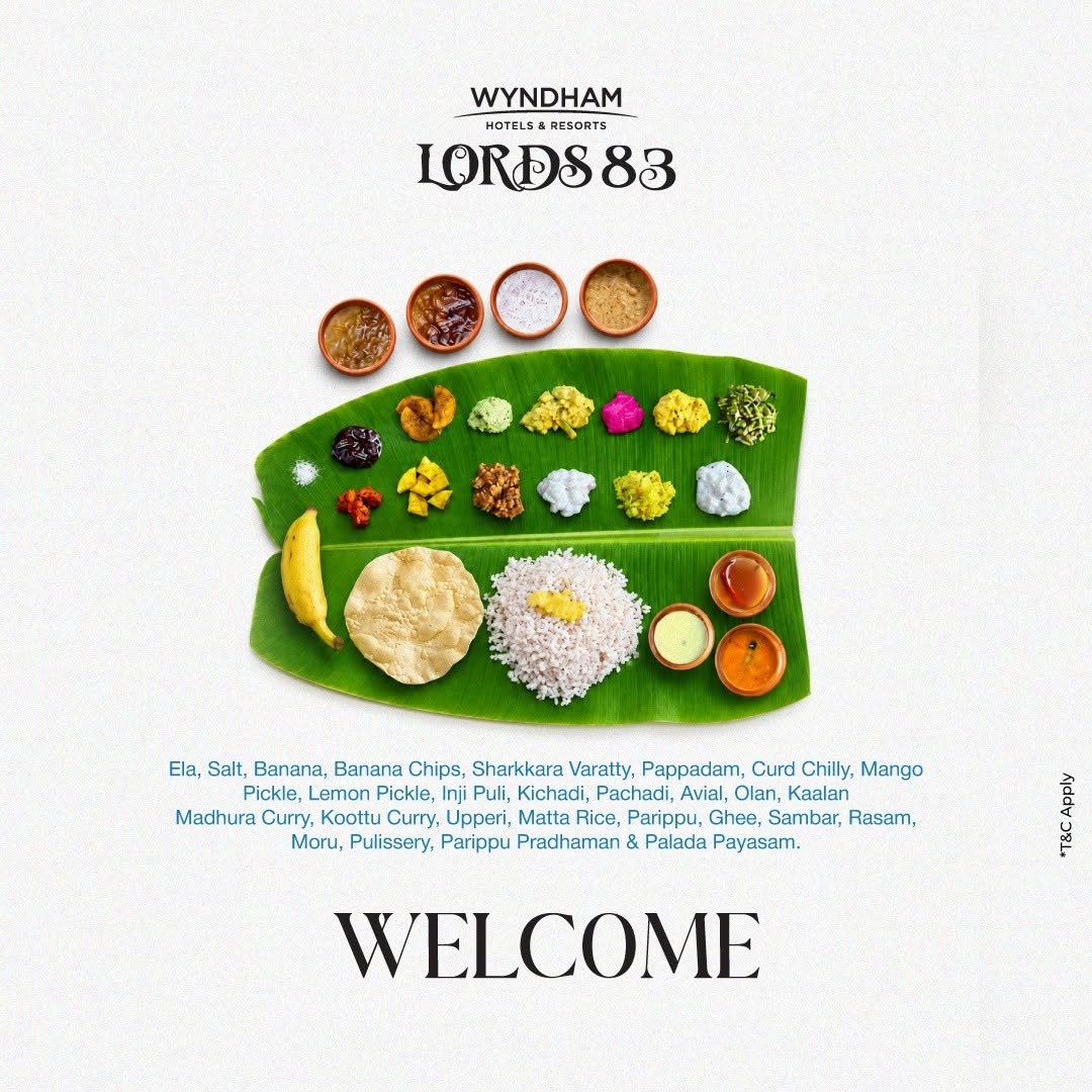 Traditional Onam Sadya served on a banana leaf with Matta rice, pappadam, avial, olan, pickles and payasam at Lords83 resort in Wayanad